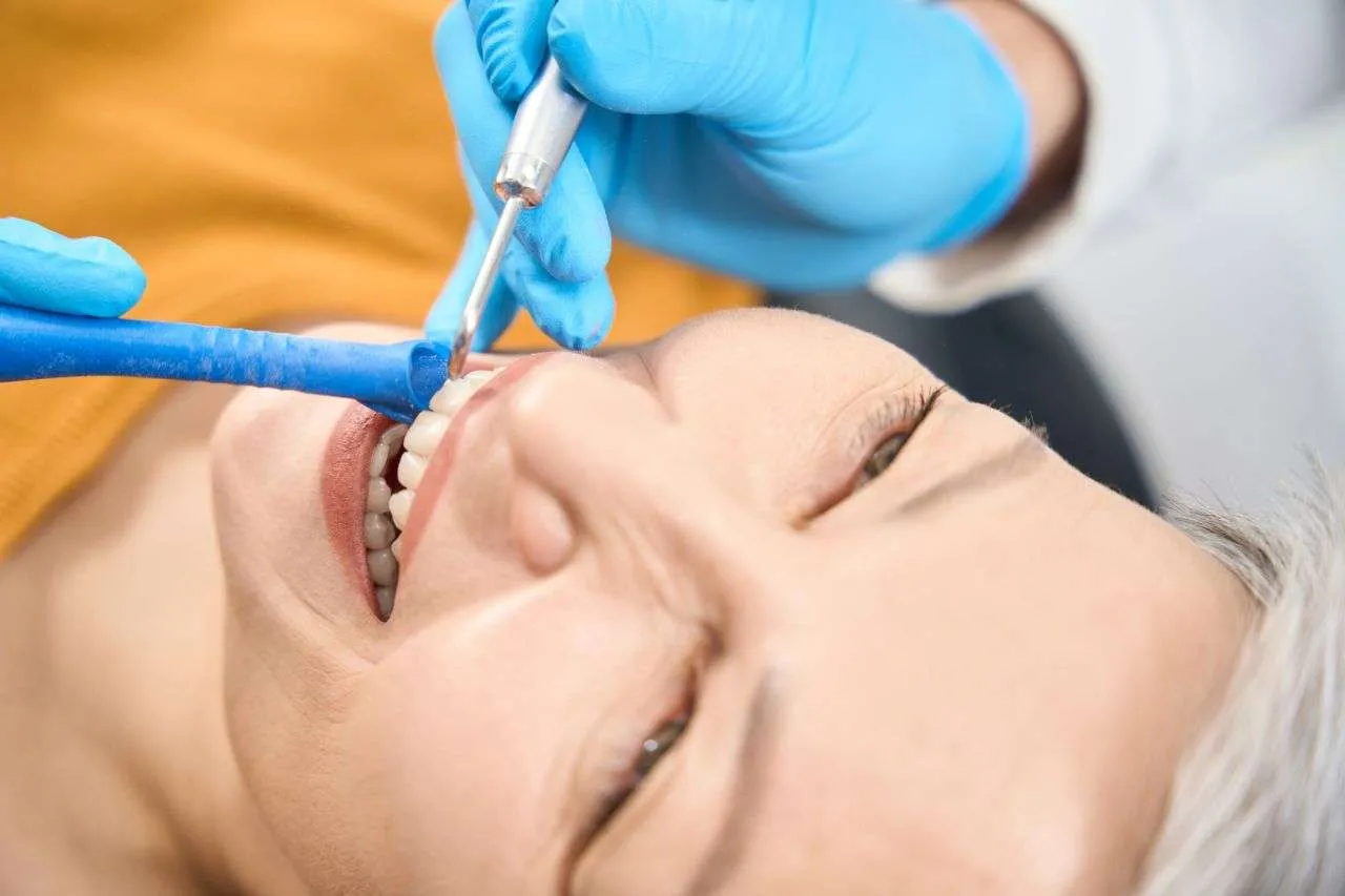 Adult Patient Smiling With Straight Teeth After Orthodontic Treatment