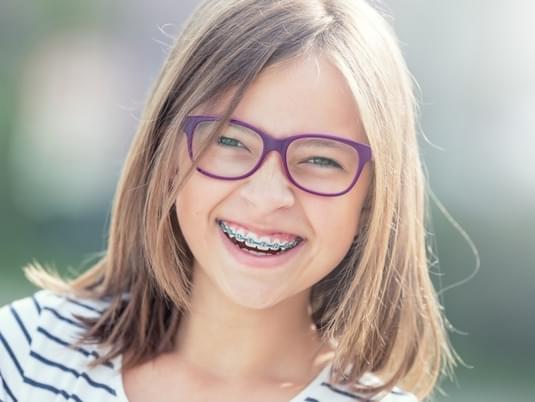 Teen Female Braces Istock 995348896 Purple